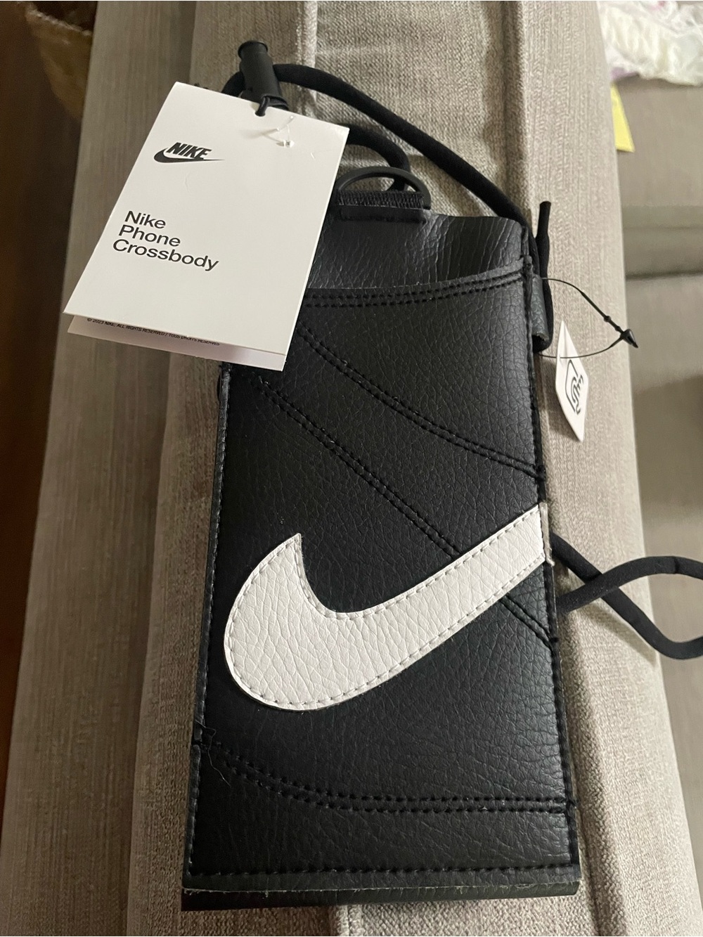 Nike Premium Phone Crossbody. NWT. Black with white Swoosh. Adjustable strap